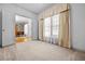 Bedroom showing a large window, neutral carpeting, an open doorway to another room at 1294 Red Rock Rd, Acworth, GA 30101