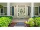 Welcoming front entrance with stone steps, white columns, green bushes, and an oval glass-paneled door at 1294 Red Rock Rd, Acworth, GA 30101