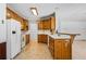 Classic kitchen with wood cabinets, modern appliances, and a breakfast bar for casual dining at 1294 Red Rock Rd, Acworth, GA 30101
