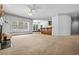 Large open living space with a fireplace, built-in bar, and natural light from the windows at 1294 Red Rock Rd, Acworth, GA 30101