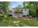 Lovely backyard with a raised deck, patio, lush greenery, and a private setting at 2316 Hurst Ne Dr, Atlanta, GA 30305