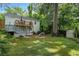 Beautiful backyard features a spacious deck, stairs and a brick patio perfect for outdoor entertaining at 2316 Hurst Ne Dr, Atlanta, GA 30305