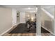 Basement gym featuring rubber flooring, a peloton bike, a mirror, and access to the stairs at 2316 Hurst Ne Dr, Atlanta, GA 30305