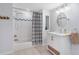 Bright bathroom with a shower-tub combination and a sleek, modern single sink vanity at 2316 Hurst Ne Dr, Atlanta, GA 30305
