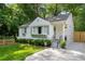 Charming white home featuring a manicured front yard, grey shutters and window boxes at 2316 Hurst Ne Dr, Atlanta, GA 30305