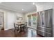 Eat-in kitchen featuring stainless steel refrigerator and access to the outdoor patio at 2316 Hurst Ne Dr, Atlanta, GA 30305