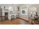Open kitchen with island seating, stainless appliances, and hardwood floors at 2316 Hurst Ne Dr, Atlanta, GA 30305