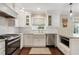 Bright kitchen features white cabinetry, stainless steel appliances, and gas cooktop at 2316 Hurst Ne Dr, Atlanta, GA 30305