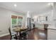Eat-in kitchen features stainless steel appliances, hardwood floors, and a breakfast table at 2316 Hurst Ne Dr, Atlanta, GA 30305
