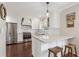 Bright kitchen with stainless steel appliances, white cabinetry, and barstool seating at 2316 Hurst Ne Dr, Atlanta, GA 30305