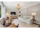 Bright living room with a large window, modern furniture, and stylish lighting at 2316 Hurst Ne Dr, Atlanta, GA 30305