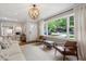Bright living room with a large window, modern furniture, and stylish lighting at 2316 Hurst Ne Dr, Atlanta, GA 30305
