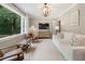 Bright living room with a large window, modern furniture, and stylish lighting at 2316 Hurst Ne Dr, Atlanta, GA 30305