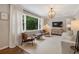 Bright living room with a large window, modern furniture, and stylish lighting at 2316 Hurst Ne Dr, Atlanta, GA 30305