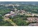 Wide aerial view showcasing the community and nearby shopping at 2420 Leaf Land Dr, Duluth, GA 30097