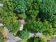 Aerial shot of the property showcasing its wooded surroundings at 2420 Leaf Land Dr, Duluth, GA 30097