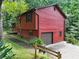 View of the side of the house featuring a garage and an inviting yard at 2420 Leaf Land Dr, Duluth, GA 30097