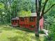 Attractive exterior view of home nestled in a lush, green, wooded environment at 2420 Leaf Land Dr, Duluth, GA 30097
