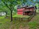 View of the home's exterior with a fenced yard and a deck at 2420 Leaf Land Dr, Duluth, GA 30097