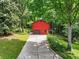 Back exterior view of the home showing driveway and garage at 2420 Leaf Land Dr, Duluth, GA 30097