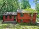 Charming split-level home with wooded surroundings and inviting front porch at 2420 Leaf Land Dr, Duluth, GA 30097
