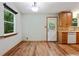 Bright eat-in kitchen featuring wood cabinets and vinyl flooring at 2420 Leaf Land Dr, Duluth, GA 30097