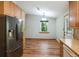 Eat-in kitchen featuring wooden cabinets, stainless steel fridge and lots of counter space at 2420 Leaf Land Dr, Duluth, GA 30097