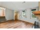 Welcoming living room with wood floors, stone fireplace, and natural light at 2420 Leaf Land Dr, Duluth, GA 30097