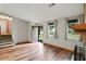 Bright living room with wood floors, stone fireplace, and natural light at 2420 Leaf Land Dr, Duluth, GA 30097
