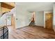 Open-concept living room with wood-style floors and staircase at 2420 Leaf Land Dr, Duluth, GA 30097