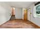 Bright living room with wood-style flooring and staircase at 2420 Leaf Land Dr, Duluth, GA 30097