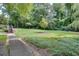 Well-maintained community park featuring lush green lawns and tall trees that provide ample shade at 3203 Lenox Ne Rd # 22, Atlanta, GA 30324
