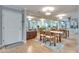 Dining room with hardwood floors, mirrored wall, and open access to the kitchen at 3203 Lenox Ne Rd # 22, Atlanta, GA 30324