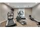 Well-equipped exercise room with treadmill, elliptical machine, rowing machine, and neutral color scheme at 3203 Lenox Ne Rd # 22, Atlanta, GA 30324