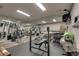Home gym with mirrored wall, weight training equipment, a rack of dumbbells, and exercise balls at 3203 Lenox Ne Rd # 22, Atlanta, GA 30324