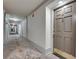 Hallway leading to the unit door with carpeted floors and neutral wall paint at 3203 Lenox Ne Rd # 22, Atlanta, GA 30324