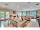 Bright, airy living room with fireplace, plush sofas, and doors that open to a peaceful outdoor space at 3203 Lenox Ne Rd # 22, Atlanta, GA 30324