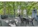 Inviting outdoor deck with patio furniture surrounded by mature trees, creating a serene atmosphere at 3203 Lenox Ne Rd # 22, Atlanta, GA 30324