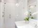Modern bathroom features a glass enclosed shower with white subway tile and brushed nickel fixtures at 3794 Jack Vernon Cir, Powder Springs, GA 30127
