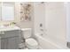 Bathroom featuring a shower/tub combination, gray vanity and updated fixtures at 3794 Jack Vernon Cir, Powder Springs, GA 30127