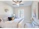 Stylish bedroom with neutral tones, a ceiling fan and a decorative gold mirror feature at 3794 Jack Vernon Cir, Powder Springs, GA 30127