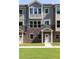 Townhome facade features a stone foundation, hardiplank siding, and a covered entryway at 3794 Jack Vernon Cir, Powder Springs, GA 30127