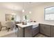 Bright kitchen view with island, stainless steel appliances, sink and dining area at 3794 Jack Vernon Cir, Powder Springs, GA 30127