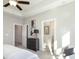 Bright main bedroom with ceiling fan and view into main bathroom at 3794 Jack Vernon Cir, Powder Springs, GA 30127