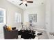 Cozy office features a ceiling fan, a modern glass-top desk and comfortable seating at 3794 Jack Vernon Cir, Powder Springs, GA 30127