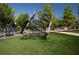 Modern playground with geometric climbing structure, set in a green park area with walking paths at 3794 Jack Vernon Cir, Powder Springs, GA 30127