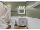 Bathroom features tile floors, a shower with curtain and a classic vanity at 6740 Mountain Lake Ln, Cumming, GA 30028