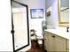 Well-lit bathroom with a stand-up shower, vanity, and stylish fixtures at 6740 Mountain Lake Ln, Cumming, GA 30028