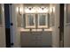 Well-lit bathroom with double vanity, modern fixtures, and clean finishes at 6740 Mountain Lake Ln, Cumming, GA 30028