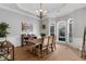Bright dining room with hardwood floors, large windows, and tray ceiling at 6740 Mountain Lake Ln, Cumming, GA 30028